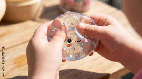 Children hands playing with squishy dumpling fidget toy
