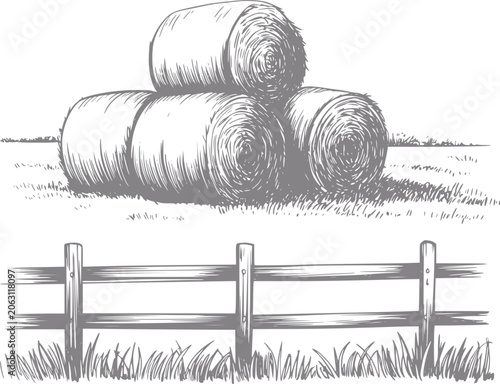 Billede på lærred Of hay bales stacked in a field with a wooden fence
