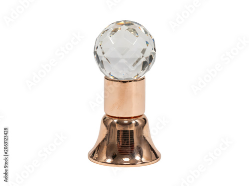 A decorative furniture knob featuring a faceted clear crystal sphere mounted on a polished rose gold metallic base, isolated on dark background