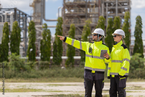 Petroleum engineers working at oil refinery site