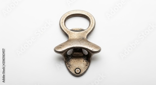 Antique Metal Bottle Opener on White Background - Vintage Bar Tool