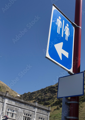 Direction sign for toilet men and women New Zealand