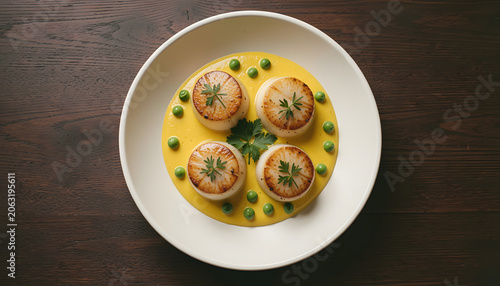 four perfectly seared scallops arranged on a vibrant yellow sauce, a gourmet dish, created with generative ai