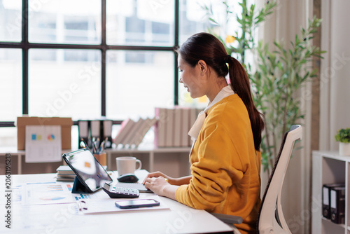 Tableau sur toile Smiling businesswoman talking during a video conference, working in her home off