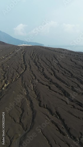 Aerial Climbing Dark Ash Slope Of Anak Krakatau Volcano Ridge