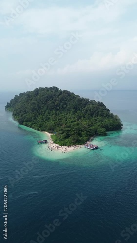 Aerial Of Small Tropical Jungle Island With Beach And Boats