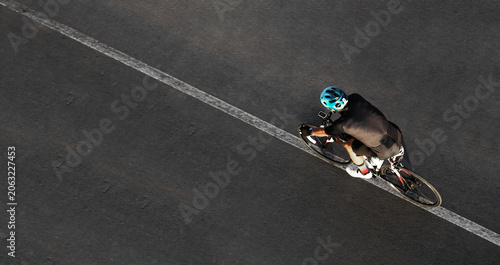 фотографія Aerial top drone high view of sporty male Cyclist with helmet shorts riding cros