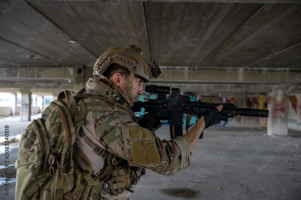 Fototapeta premium Special armed military squad team in full gear patrolling an abandoned building during hostage crisis
