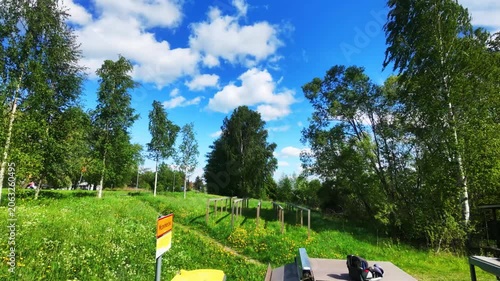 Cloudy Summer Day in Rural Landscape with Moving Cars