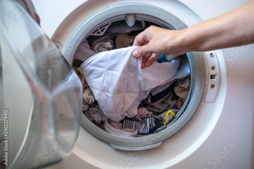 Gentle clothing cleaning process. Home laundry session focusing on gentle cleaning and maintenance of delicate textiles