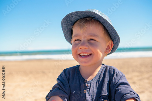 Children exploring emotions at the beach during sunny weather with blue sky and waves