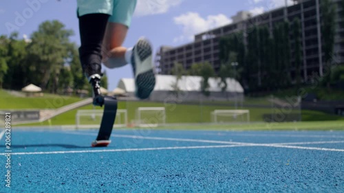 Trained man jogger with bionic leg prosthesis starts running