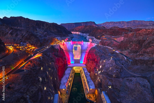 Hoover Dam Nevada Lit With American Flag and Red White Blue Lights at Night