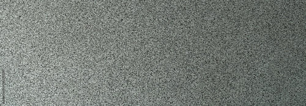 Fototapeta premium Terrazzo cement background with black and white stone grains scattered all over concrete floor