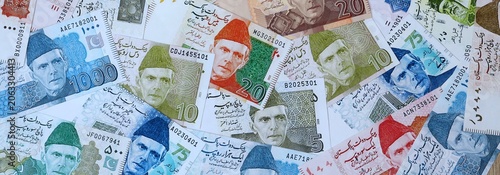 Obraz na plátně Pakistani rupee money banknotes bunch on table