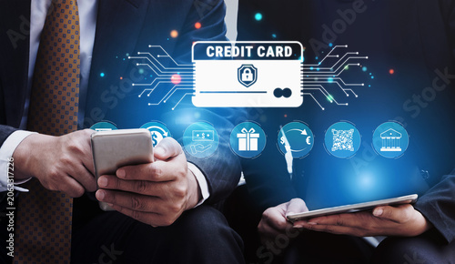 Fotografía Financial technology concept with people using mobile devices to transact securely online and icons representing digital payment and credit card transactions Quark