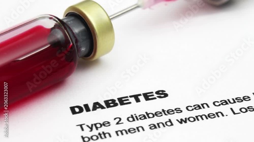 Diabetes Medical Concept with Syringe and Medication Vial on Healthcare Document