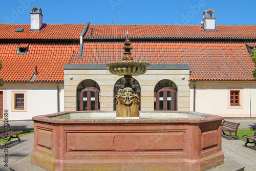 A view of a fountain on a summer day in the castle courtyard in the spa town of Podebrady, Czech Republic.