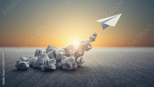 Surmounting challenges. Business strategies. Defeating hurdles. Path to achievement. Paper airplane glides through crumpled balls
