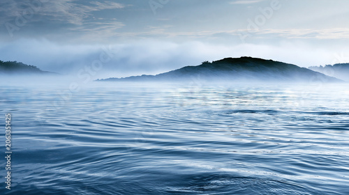 Misty Seascape with Rolling Waves and Distant Hills