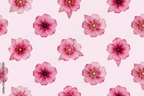 A bunch of red flowers on a pink background