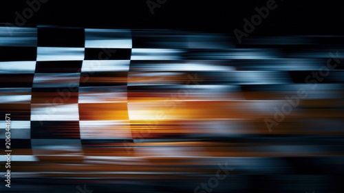Abstract motion blur of a checkered racing flag in the dark