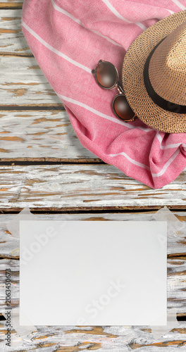 Summer Holiday Vacation Trip Mockup Concept Wallpaper with White Blank Free Space Paper Sheet with Adhesive Tape on Wooden Surface. File with Clipping Path.