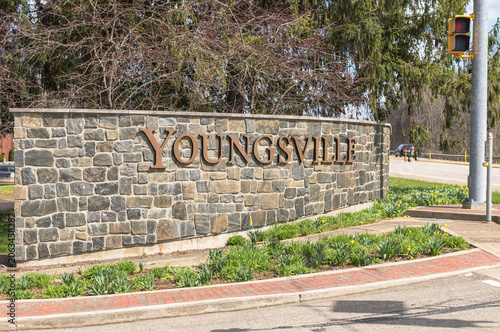 A stone wall with Youngsville on it in Youngsville, Pennsylvania, USA on a sunny winter day