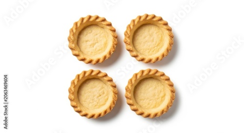 Four empty tart shells isolated on white background