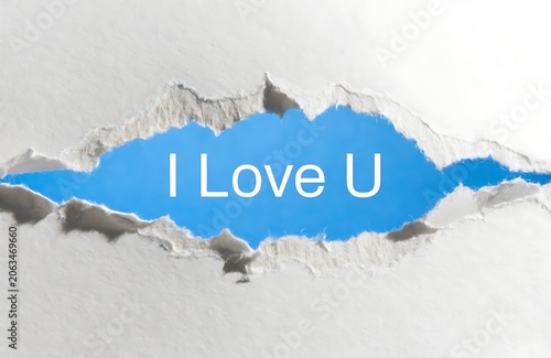 I Love U Message Revealed Under Ripped Paper for Romantic Occasions