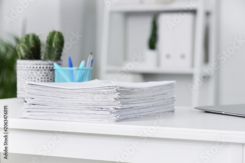 Stack of white paper docume...