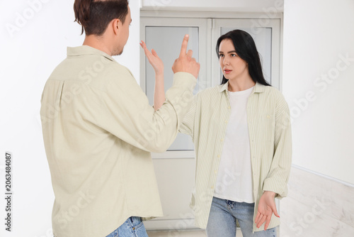 Young couple arguing and di...