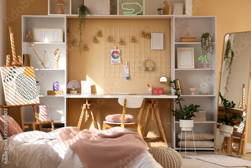 Stylish teenage room with c...