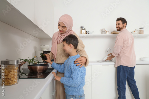 Happy Muslim family cooking...