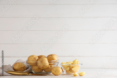Glass bowls with raw potato...