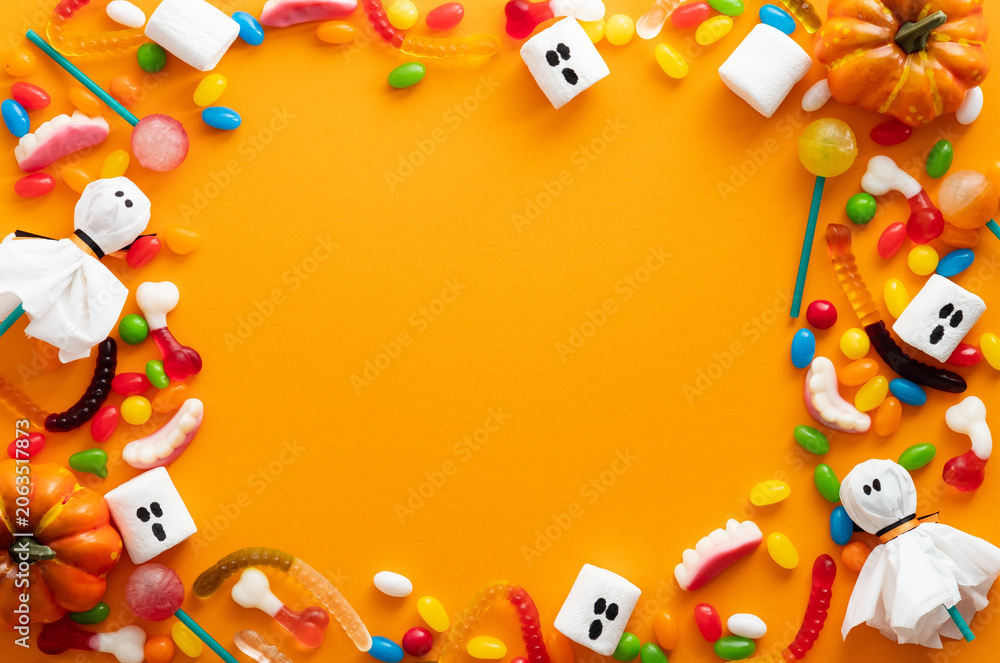 Fototapeta premium Halloween Candy Arrangement With Marshmallows And Pumpkins Flat Lay