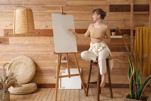 Young female artist with pa...