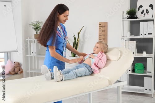 Female pediatrician examini...