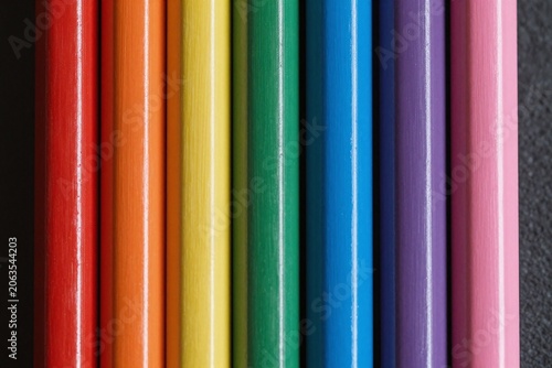 A bunch of different colored pencils sitting next to each other