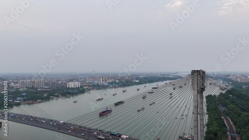 A spectacular aerial drone perspective of the majestic Vidyasagar Setu (Second Hooghly Bridge) in Kolkata, India, showcasing its intricate cable-stayed design spanning the river.