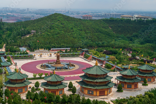 The Huayan Fountain Square and the Pilu Palace in the Nanshan scenic area of the Jiaodong Peninsula on a sunny summer day, Longkou, Yantai, Shandong, China