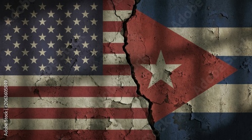 Cracked american and cuban flags symbolize strained relations