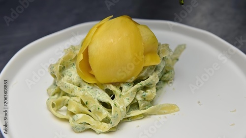 Deviled egg with lettuce on a white plate