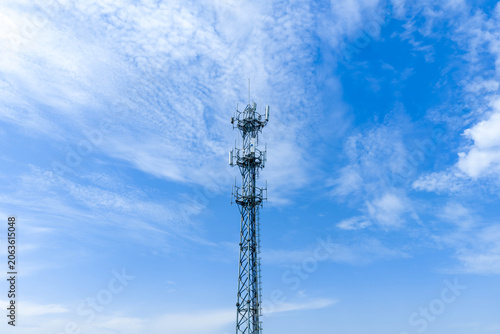 5G communication tower under clear blue sky, real shot of mobile communication base station signal tower