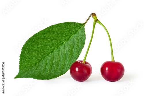 Two red cherries with green leaf on white background. Fresh organic fruit for healthy diet and culinary ingredient. Isolated berry for food design.