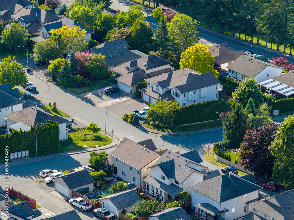 Fototapeta premium Aerial View Of Promontory Suburban Neighborhood In Chilliwack, British Columbia, Canada With Tree-Lined Streets
