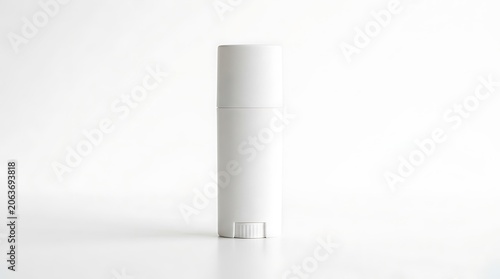 Minimalist white cylinder object on plain background.
