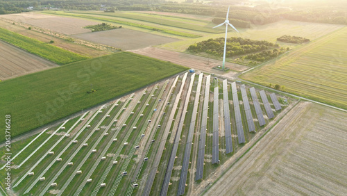 Solar panels installation near wind power turbine