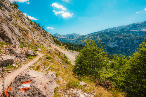 фотографія Alpine hiking trail from Prijevor in Bosnia to Trnovacko Lake in Montenegro, dramatic Dinaric Alps in Sutjeska park landscapes and crystal clear turquoise water