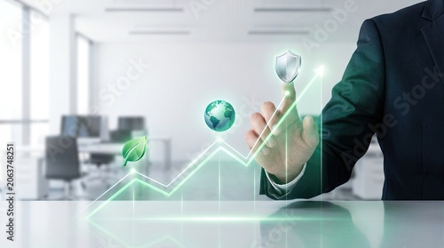 Businessman analyzing graph data in modern office environment